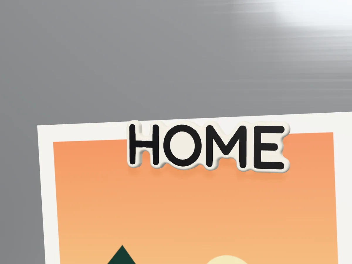 Customized fridge magnet reading HOME holding a picture on a fridge door